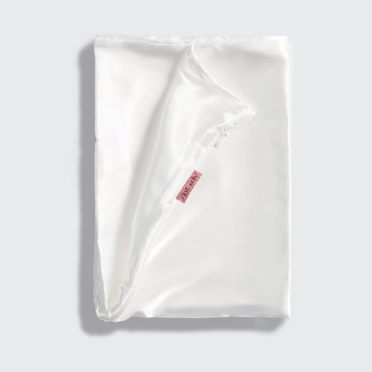 KITSCH Ivory Standard Satin Pillowcase — styled bedroom scene
